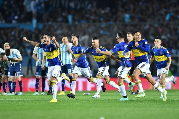 AVELLANEDA, ARGENTINA - AUGUST 30: Nicolas Figal (L) of Boca Juniors celebrates with teammates after winning the penalty shoot out during a second leg quarter final match between Racing Club and Boca Juniors as part of Copa CONMEBOL Libertadores 2023 at Presidente Peron Stadium on August 30, 2023 in Avellaneda, Argentina. (Photo by Marcelo Endelli/Getty Images)