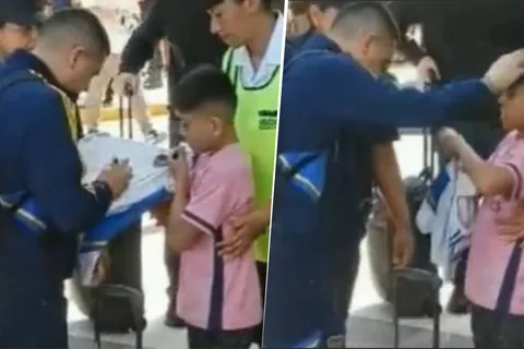 Juan Román Riquelme junto a un niño en Mendoza