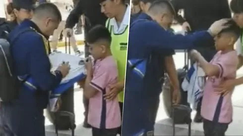 Juan Román Riquelme junto a un niño en Mendoza