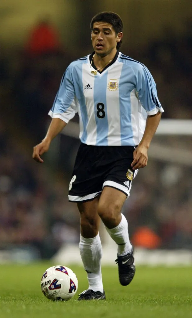 13 Feb 2002: Juan Roman Riquelme of Argentina runs with the ball during the International Friendly match against Wales played at the Millennium Stadium, in Cardiff, Wales. The match ended in a 1-1 draw. DIGITAL IMAGE. Mandatory Credit: Phil Cole/Getty Images
